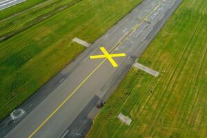 airport runway closed mark x yellow cross color . photo