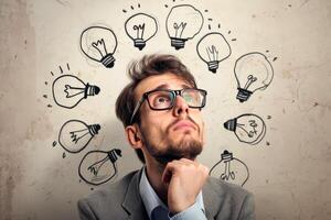 business man look up a light bulb in the classroom, concept of ideas and creativity. photo
