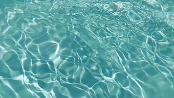 Bluewater waves on the surface ripples blurred. Defocus blurred transparent blue colored clear calm water surface texture with splash and bubbles. Water waves with shining pattern texture background. video