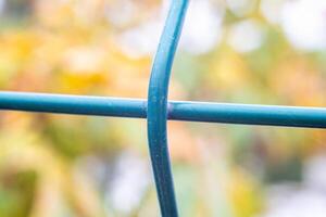 Background splash metal fence with weaving in the form of a cross photo