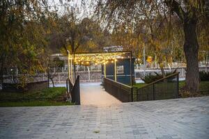 Evening festive path decorated with bright lanterns photo