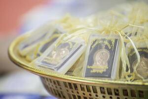 Amulets are small things that Buddhists like to worship. photo