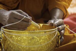 making holy water, buddhism, beliefs in thailand photo