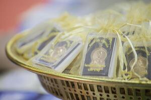 Amulets are small things that Buddhists like to worship. photo