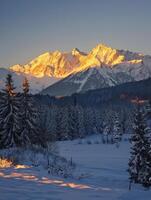 Golden Sunrise Over SnowCovered Tatra Peaks Creates Tranquil Magic photo
