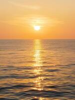 Calm Ocean Tinged with Creamy Sunset Glow photo