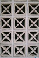 Ventilation grille installed in a wall, highlighting the structure's airflow and cooling system photo