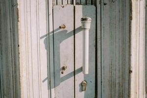 Metal handle of a rolling door, emphasizing durability and functionality in industrial settings photo