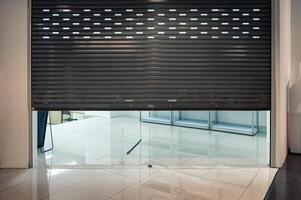 Abamdomed roll shutter gate of shop closing in department store photo