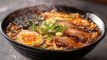 Classic ramen bowl topped with pork egg and green onions photo