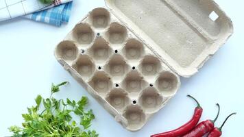 egg carton without eggs on table , video