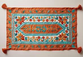 an orange and turquoise traditional hispanic embroidered table runner photo