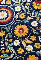 a close up of a colorful traditional hispanic embroidered fabric photo