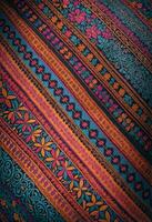 a close up of a colorful fabric with a tradtional hispanic pattern photo