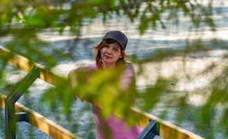 Young Woman in Nature Captivating Portrait Through Leaves photo
