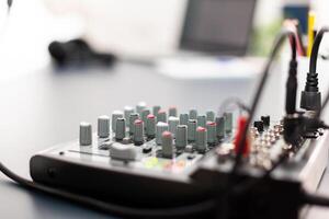 Mixer close up of vlogger home podcast studio. Social media influencer recording professional content with modern equipment and digital web internet streaming station photo