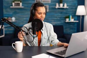Stylish woman recording vlog and sharing content on streaming platform using social network. Influcencer woman in digital marketing making brodcast for offering lifestyle advice. photo