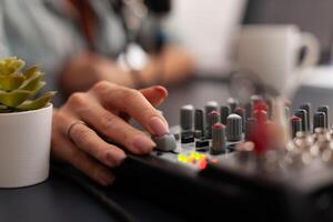 Close up of online live podcast studio desk with mixer in home studio of new creator. Influencer recording social media content with professional equipment for subscribers photo