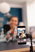 Close up of blogger recording giveaway for subscribers. Creative content creator social media star talking online about professional mouse at home studio podcast photo