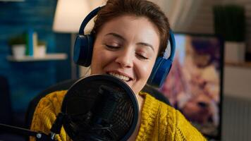 Close up of blogger talking on podcast microphone during streaming, new vlog series. On-air online production internet broadcast show host live content, recording digital social media communication photo