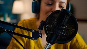 Creative show vlogger presenter recording sound in home studio for podcast. On-air online production internet broadcast show host streaming live content for digital social media using internet web photo