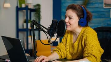 Famous blogger in home studio broadcasting using modern technology. Creative online show on-air production internet broadcast host streaming live content, recording digital social media communication photo