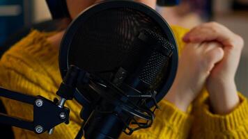 Close up of influencer discussing with fallowers during live on social media recording vlog. On-air online production internet broadcast show host streaming live content, blogger during livestreaming photo
