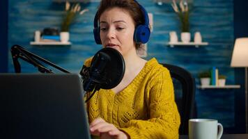 Vlogger looking at laptop while asking audience to subscribe on her channel. Creative online show On-air production internet broadcast host streaming live content, recording digital social media communication photo