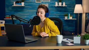 Vlogger looking at laptop and asking audience to subscribe on her channel. Online show On-air production internet broadcast host streaming live content, recording digital social media communication photo