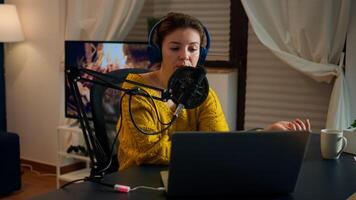 Vlogger on air during online show using laptop, reading emails. Creative online show On-air production internet broadcast host streaming live content, recording digital social media communication photo