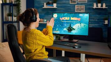 Esport of pro gamer playing game with new graphics winning championship, stylish design cyber games room. Virtual shooter game in cyberspace, esports player performing on pc gaming tournament photo