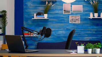 Empty professional setup for recording podcast in home studio of vlogger. Influencer recording social media content with production microphone, digital web internet streaming station photo
