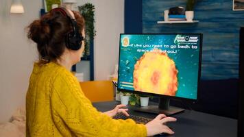Angry professional gamer because it's game over for her during an online championship. Champion player testing online games on her personal computer with modern technology network wireless. photo