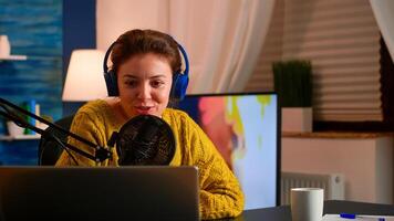 Vlogger speaking with follower on live using professional microphone wearing headphones. Creative online show On-air production internet broadcast host streaming live content, recording digital social photo