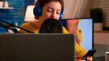 Vlogger messaging with online audience while recording podcast in home studio for social media. Creative online show On-air production internet broadcast host streaming live content for social media photo