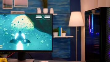 Videogamer using professional computer playing space shooter game from home. Online streaming cyber performing on powerful personal computer during gaming tournament photo