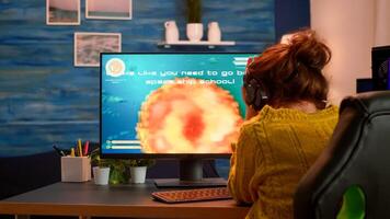 Sad pro gamer woman nervous to get started space shooter videogame during virtual competition. Online shooter game in cyberspace, esports player performing on pc gaming tournament photo