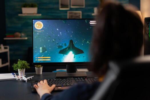 Digital gamer playing esport games for virtual tourtament use professional gaming equipment. Pro player streaming on powerful computer online game new graphics using RGB keyword photo