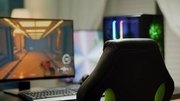 Professsional gaming room with nobody in, neon lights and RGB powerful computer, keyboard and mouse. FPS shooter game on pc display, studio of esport, FPS shooter game photo