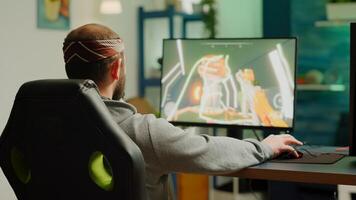 Professional cyber gamer playing shooter videogame with new graphics on powerful computer from gaming room. Virtual shooter game performing in cyberspace, esports player esports online tournament photo