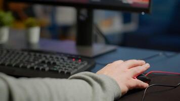 Close-up of man hands gamer playing game using RGB keyboard during virtual championship in cyberspace. Online streaming cyber performing on powerful personal computer during gaming tournament photo
