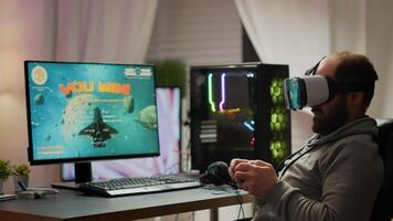 Pro cyber sport gamer wining playing games using vr headset. Virtual space shooter game championship in cyberspace, esports player performing on powerful computer during gaming tournament photo