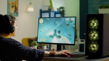 Pro gamer streaming online game with new graphics from gaming room using RGB powerful computer playing space shooter game for live tournament late at night. Professional player in esports photo