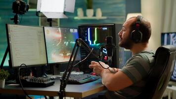 Pro cyber streamer losing videogame tournament while wearing professional headset holding wireless controller. Defeated gamer using joystick for online competition late at night in gaming room photo