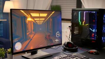 Close-up of empty gaming home studio equipped with RGB powerful system desktop, keyboard, mouse and professional headphones. Gamer playing first person shooter for online esport competition photo
