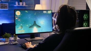 Competitive player losing e-sport championship using technology network wireless. Defeated woman playing online space shooter competition with powerful professional computer photo