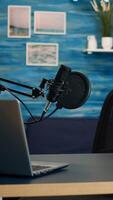 Empty podcast room with professional microphone in vlogger home studio in living. Influencer recording social media content with production microphone, digital web internet streaming station photo