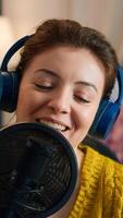 Close up of blogger talking on podcast microphone during streaming, new vlog series. On-air online production internet broadcast show host live content, recording digital social media communication photo