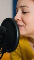Entertainment blogger broadcasting from home studio new show in the night. On-air online production internet broadcast show host streaming live content, recording digital social media communication photo