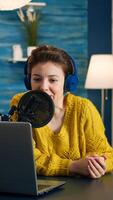 Blogger speaking with followers on live podcast using headphones. Creative online show On-air production internet broadcast host streaming live content, recording digital social media communication photo